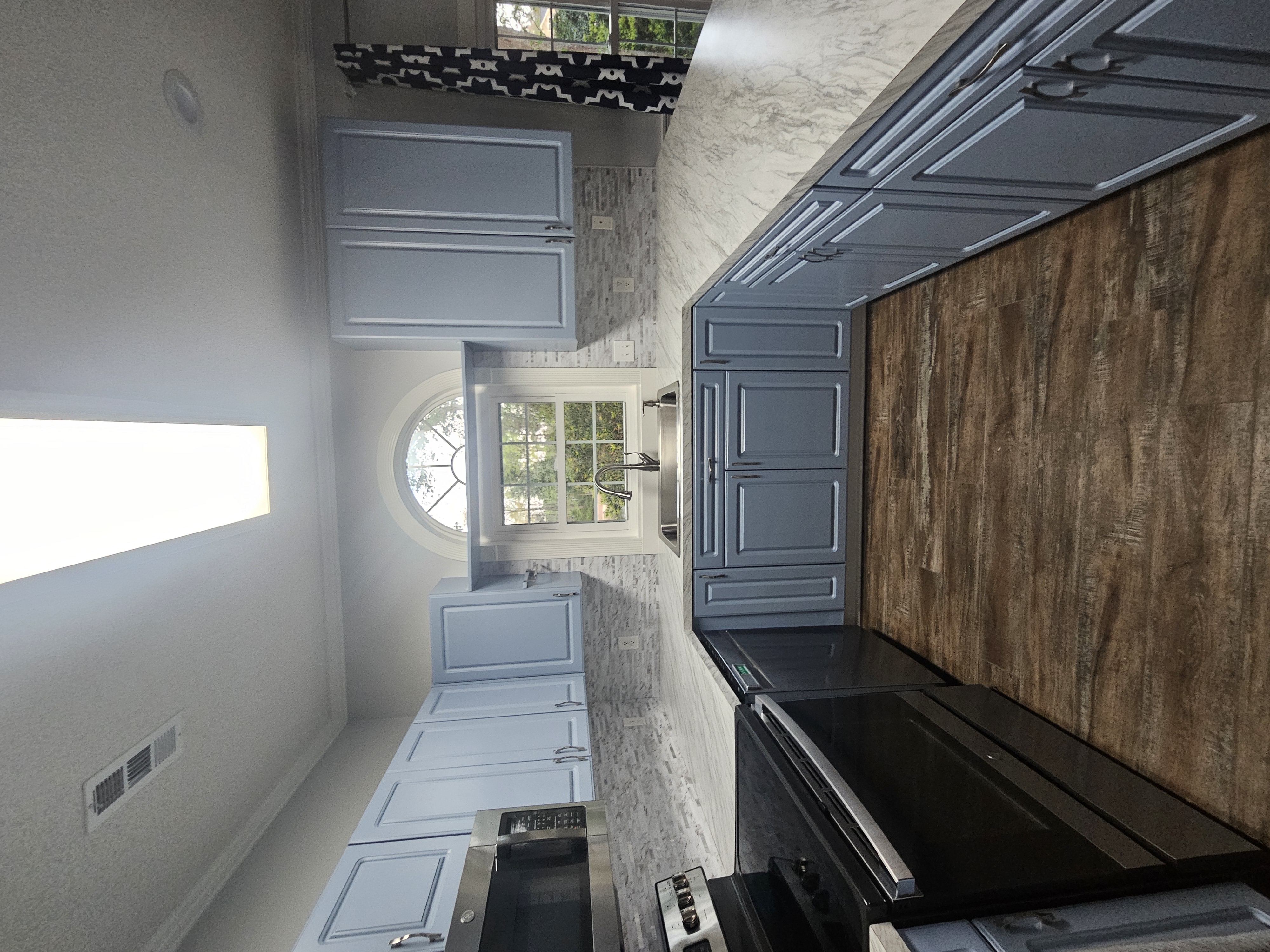 all new countertop, fresh cabinet paint, and new backsplash